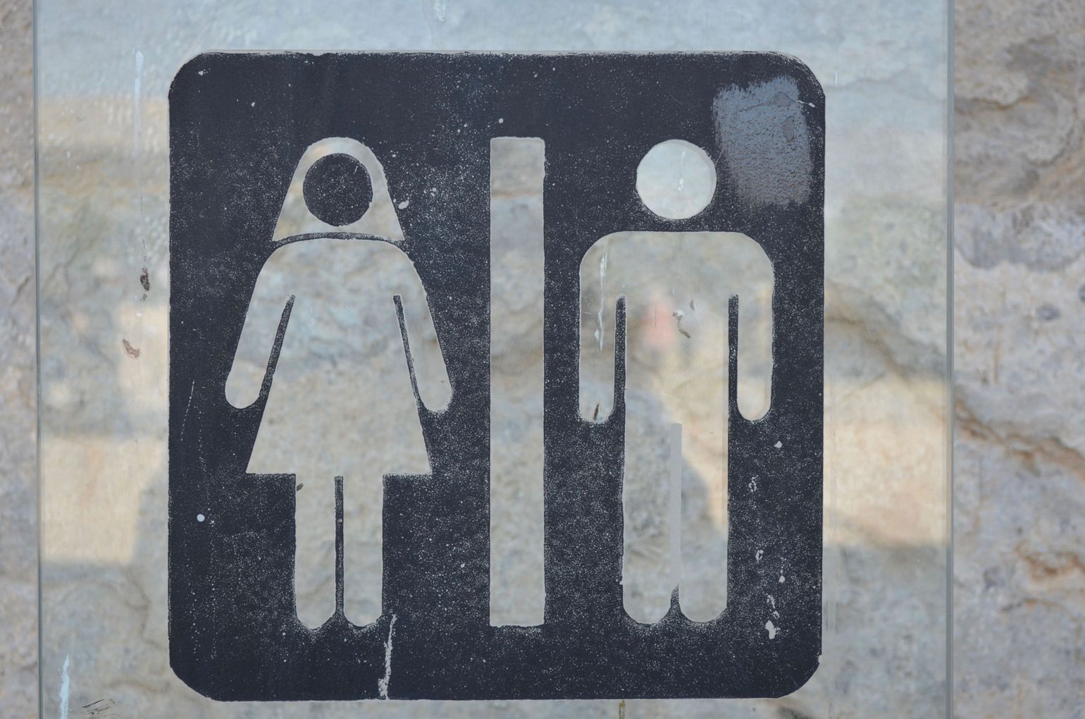 Toilet symbool op reis in Iran met Joker